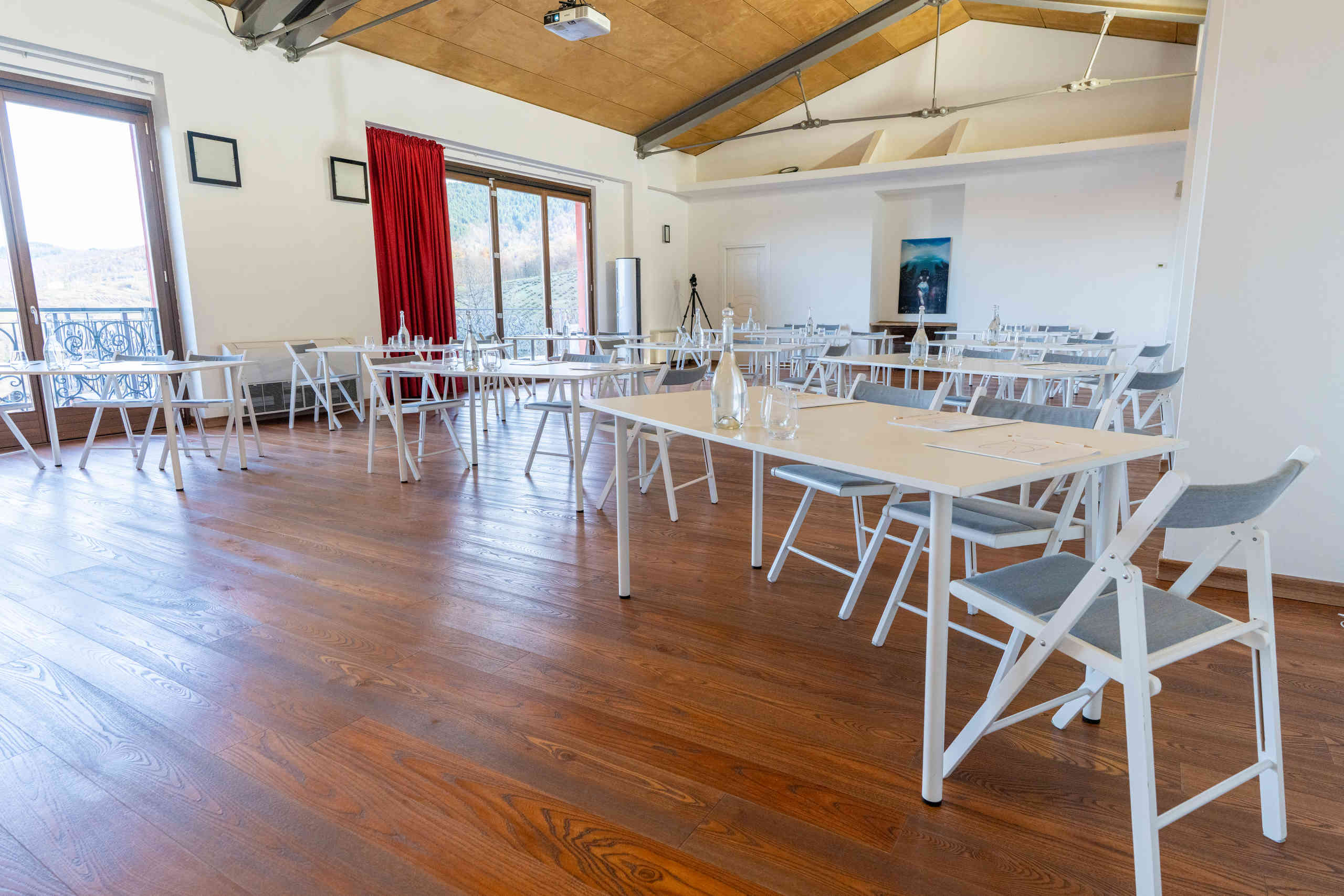 empty-classroom-with-wooden-floor-and-white-chairs