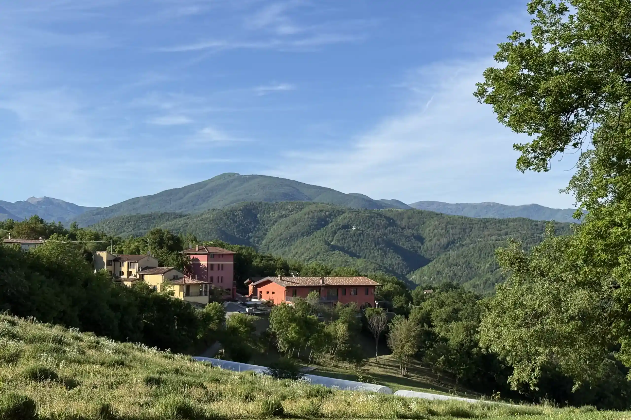 hilltop-hamlet-surrounded-by-wooded-hills