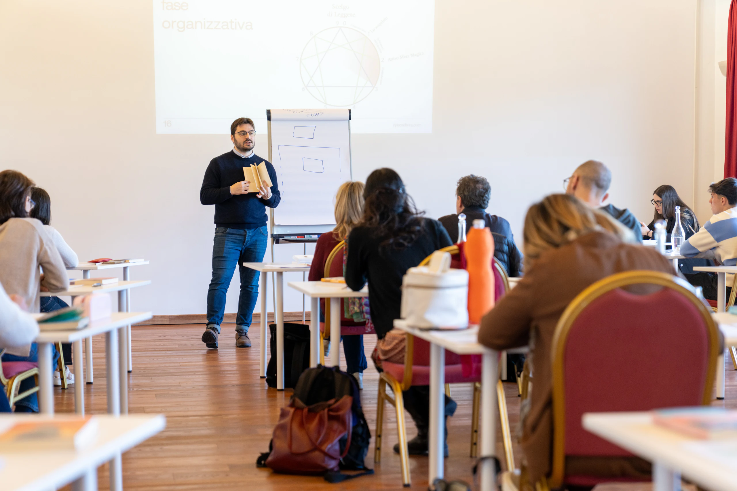 A participant presenting at a flipchart