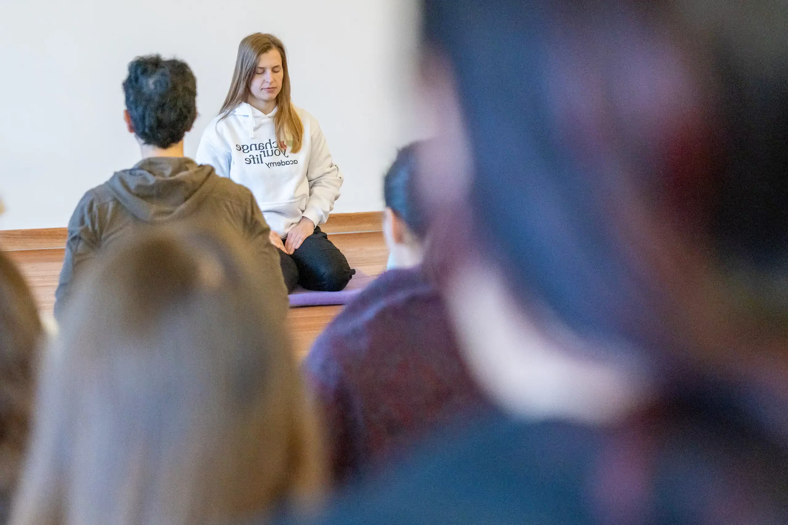 A participant meditating during a group session