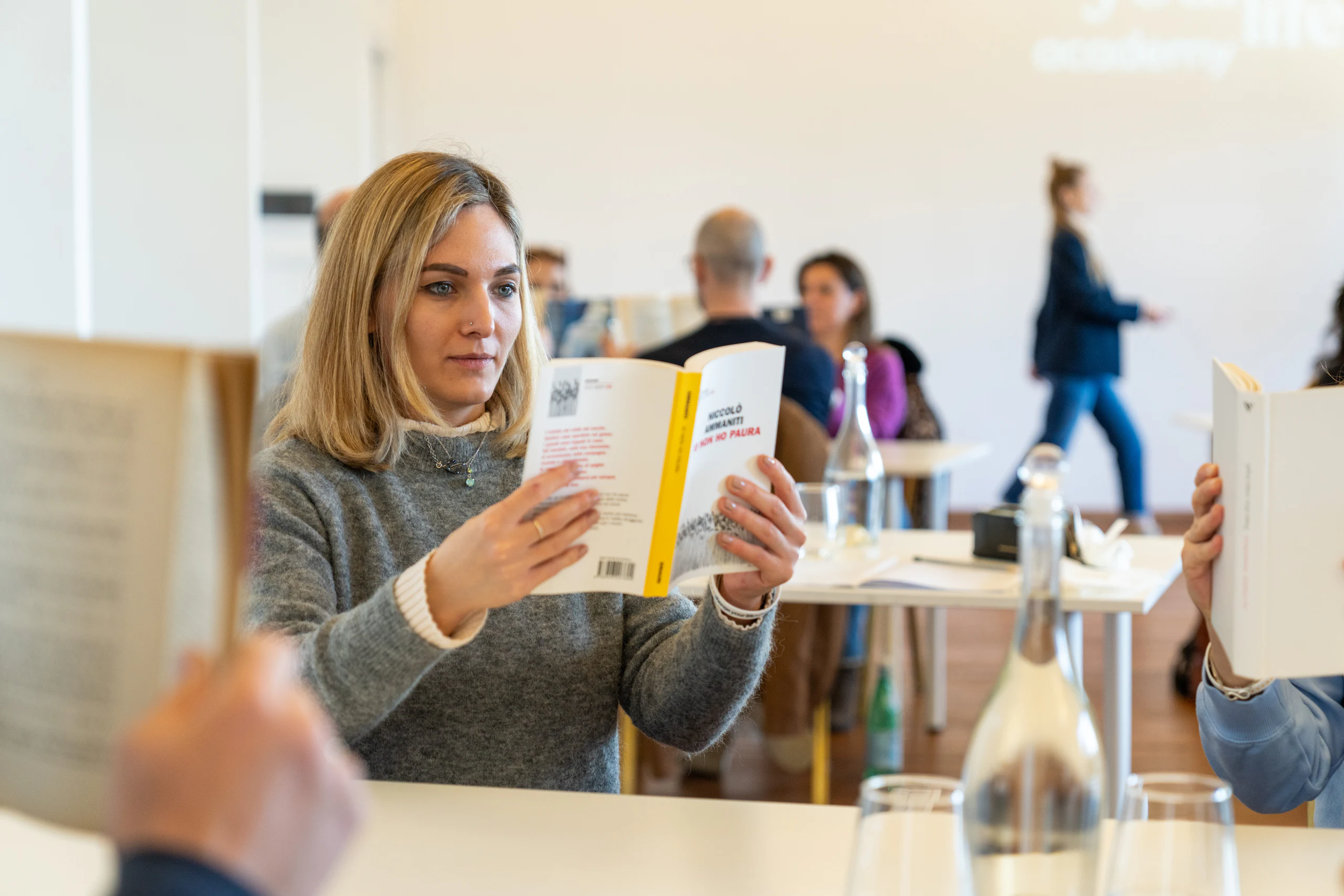 A participant reading during a workshop